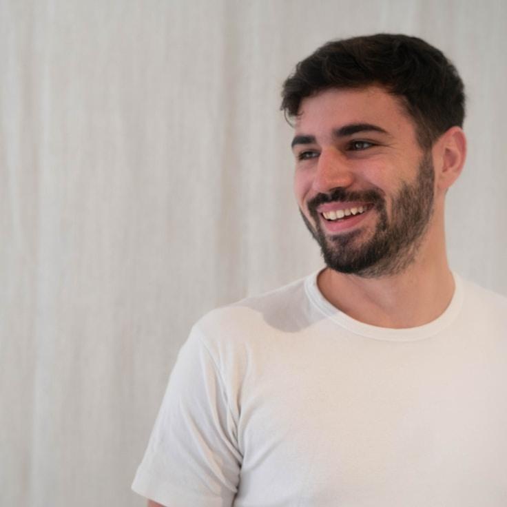 Avery Chen, Lead Design Curator at Quanta Corese Cur, reviewing corporate floral arrangements